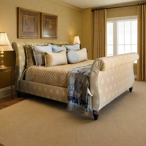 Gold upholstered bed with decorative pillows in a bedroom setting.