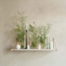 Load image into Gallery viewer, Decorative shelf with plants and candles against a plain wall
