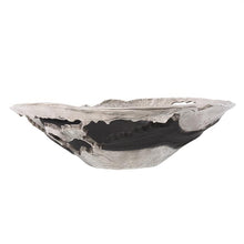 Load image into Gallery viewer, This contemporary flared bowl is a play on abstract, deconstructed design. Fashioned from aluminum, it has a raw, hand formed look that create a dramatic statement for your style. The raw silver finish is accented with cut outs and matte black sections that make the entire piece the perfect finishing touch for your decor. Pair with the coordinating pieces in the collection for a complete look.
