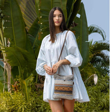 Load image into Gallery viewer, Complete your boho look with this tribal pattern crossbody bag. The compact size of the bag makes it easy to carry and the strong zippered top secures your valuables.
