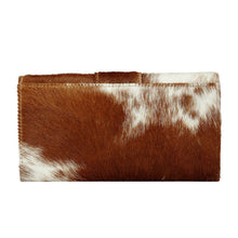 Load image into Gallery viewer, It is handmade from the hair on the leather, which augments its visual aesthetic and provides durability. It is intricately designed with stitching detail in the front, which gives offers a sturdy texture to the wallet.
